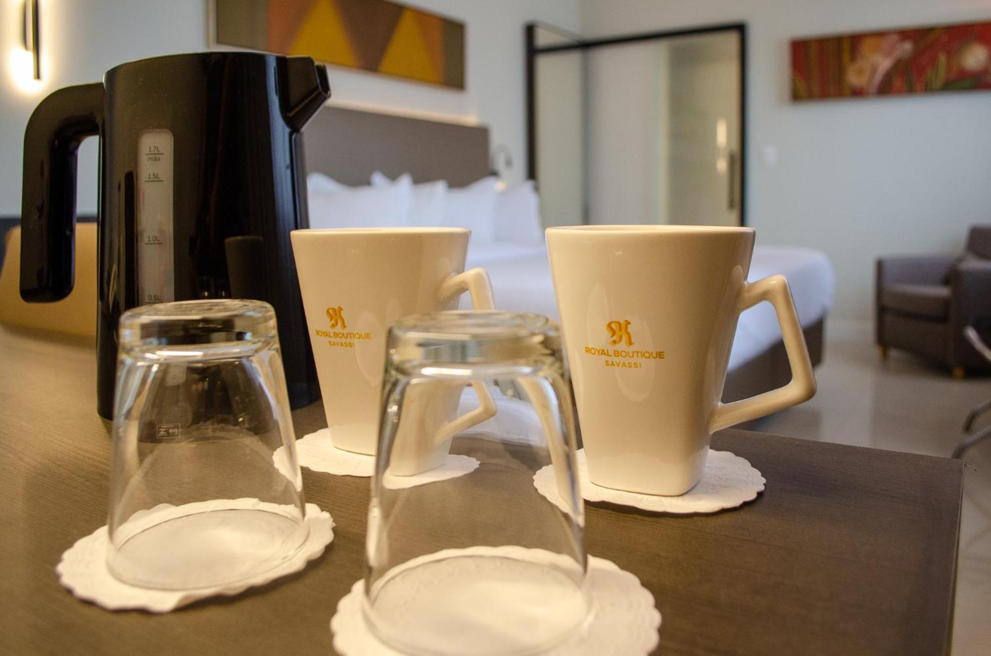 Royal Boutique Savassi Hotel Belo Horizonte Eksteriør bilde A coffee pot and two cups